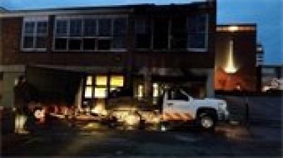 Vehicle Fire Extends to Building